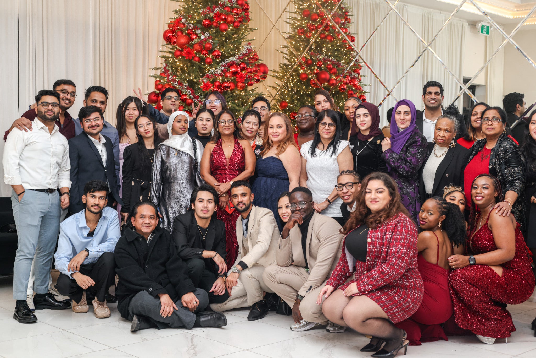Group portrait of the Shoppers Drug Mart staff celebrating their Christmas banquet, showcasing event photography by Memoirs Photography.