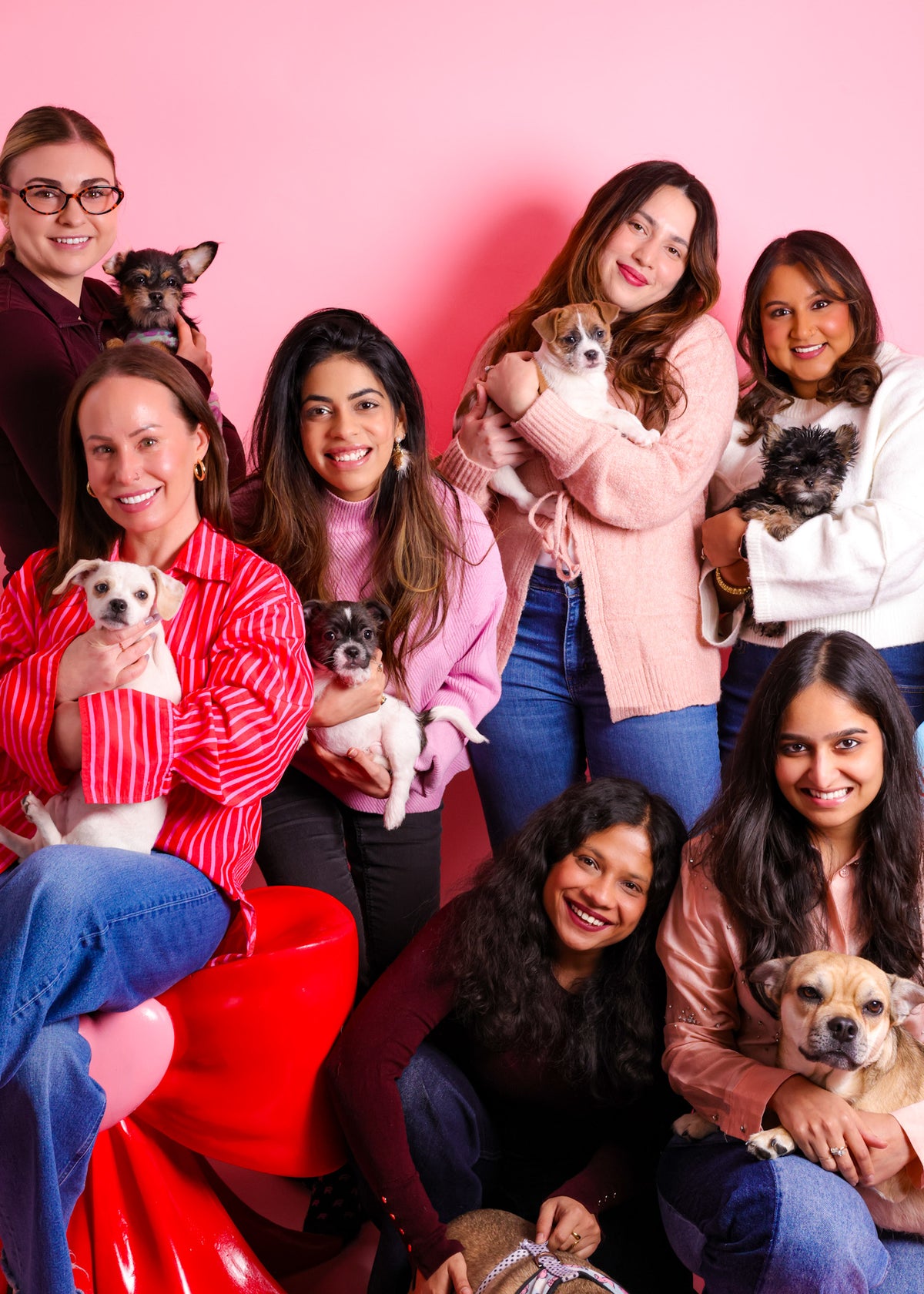 Corporate team group photo at formal company celebration event.
