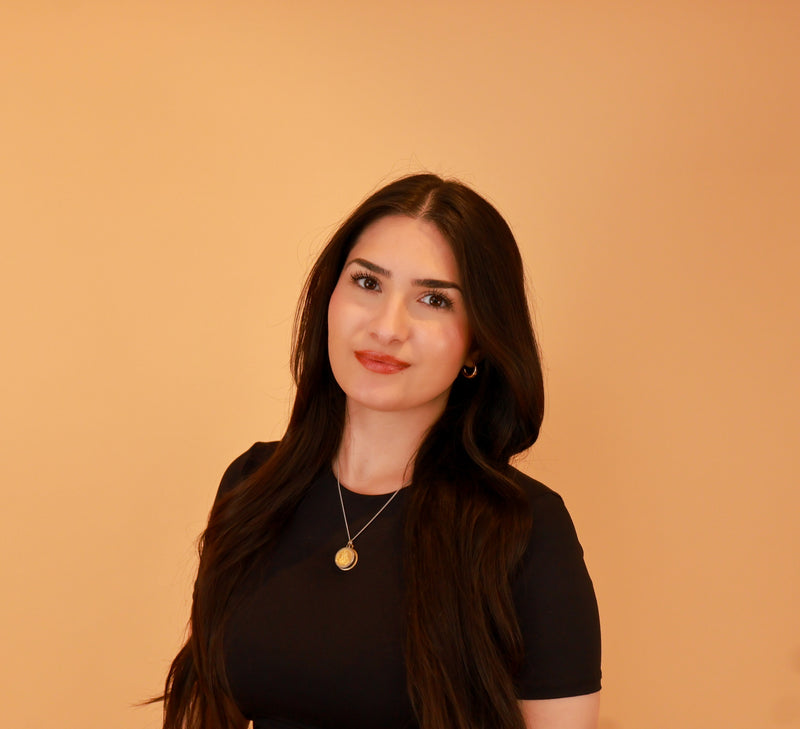 Professional studio portrait photography in Toronto featuring a clean, modern headshot against a warm neutral backdrop.